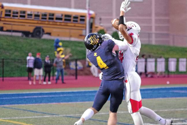 In the first half, Jefferson wideout Jason Post (4) is unable to haul in the ball as it bounces between him and Whippany Park defensive back Oleksandr Kulyk. The ball eventually falls to the ground for no gain.
