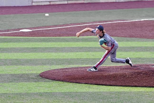 <b>Brockton Rox pitcher Michael Quigley throws the ball. He pitched for five innings.</b>