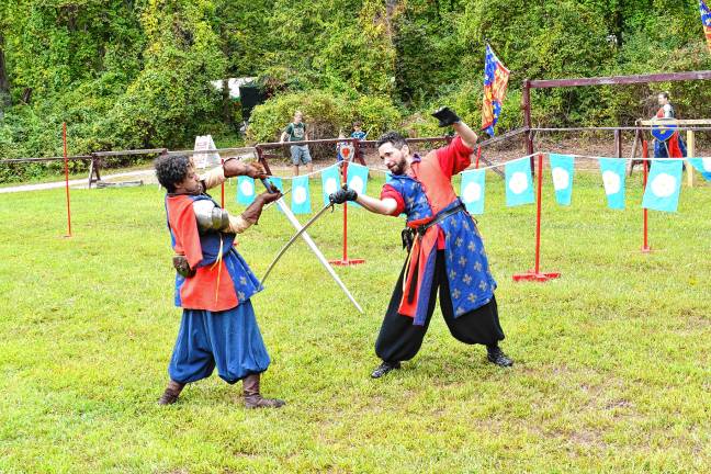 SRF1 Two knights demonstrate their sword-fighting skills Sunday, Sept. 7 at the Sparta Renaissance Festival. (Photos by Maria Kovic)