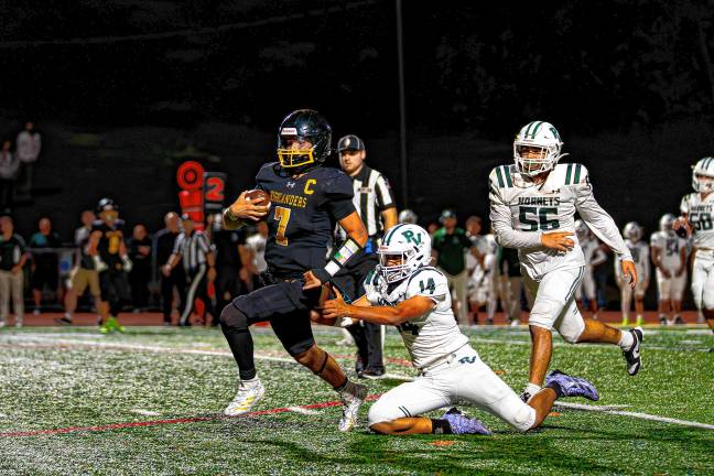 A Passaic Valley player attempts to tackle Aydin Deane in the fourth quarter.