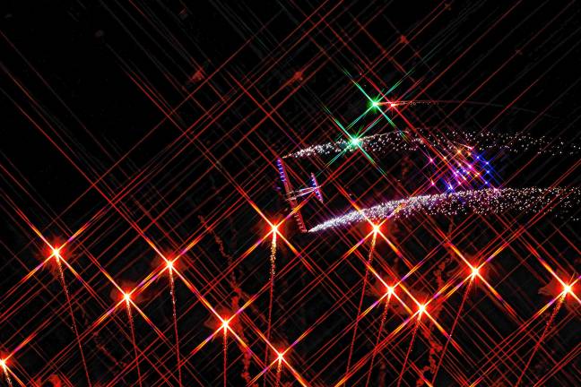 Nate Hammond flies through fireworks. (Photo by TJ Nolan)