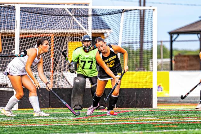 Senior Cara Bruce clears the ball from outside the net.