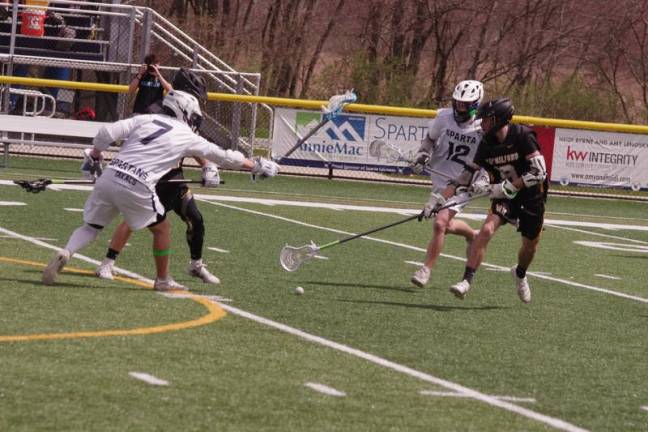 Sparta Spartans and West Milford Highlanders battle for control of the ball.