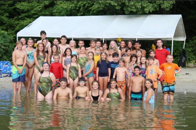 The West Milford Devil Rays swim team poses for a group photo in August 2021.