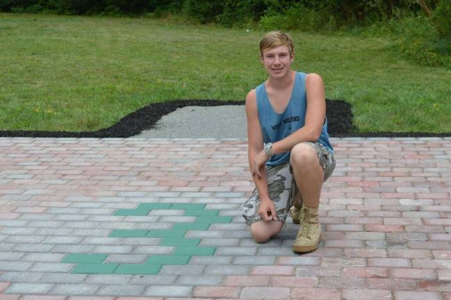 Photo provided Lukas Graf, a member of Troop 114, achieved the rank of Eagle Scout in May after building a patio for Greenwood Forest Fire Company Three in West Milford.