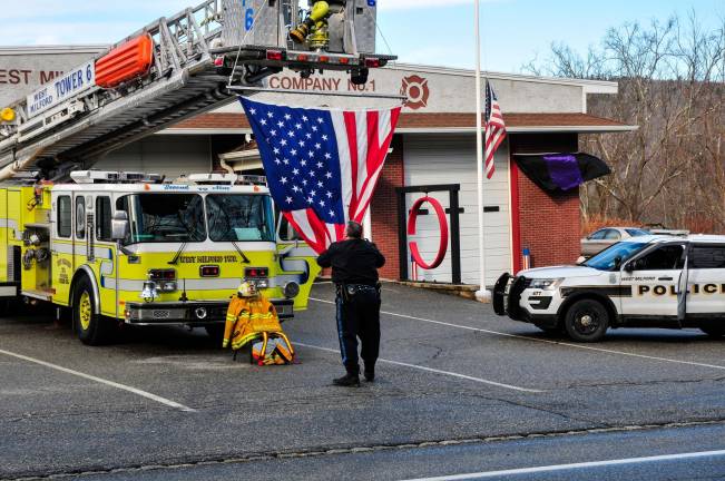 Members of Fire Company 6 on Ridge Road prepared for the funeral, hoisting a large American flag from its ladder and setting up the fire fighting equipment to honor Birdsall.