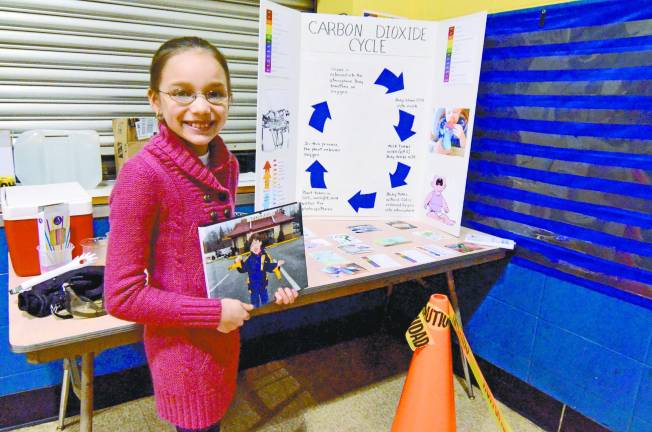 Marie Parkin explained her “Carbon Dioxide Cycle” with a dry-ice demonstration (and a picture of her brother).