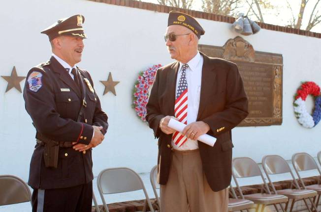 Photos by Don Webb West Milford police Chief Timothy Storbeck, left, thanked many of the veterans who attended the ceremony for their service including Glenn Wenzel.