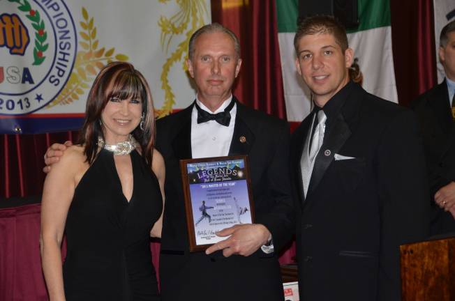 Grandmasters Cynthia Rothrock, left, and Eric Kovaleski flank Doug Cook, head instructor of the Chosun Taekwondo Academy in Warwick after Cook was inducted recently into the Legends of the Martial Arts Hall of Fame as its 2013 Taekwondo Master of the Year.