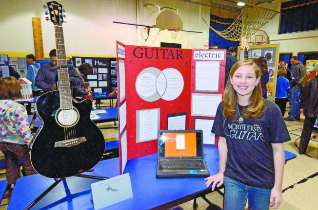 Rachel Koblitz was well prepared to explain the differences between acoustic and electric guitars.