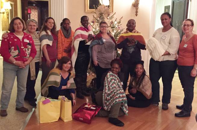 Photo courtesy of Loyola Jesuit Center The women are seen here with their prayer shawls, donated by churches including St. Thomas the Apostle Church in Oak Ridge and St. John Vianney in Stockholm.