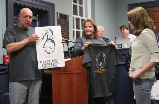 Photo by Linda Smith Hancharick Ashley Santangelo, right, is recognized at the township council meeting for her winning design for the Beautification Day T-shirt. Bill Weaver holds the artwork while Melissa Brown-Blauer holds the new T-shirt. Both are members of the Beautification and Recycling Committee.