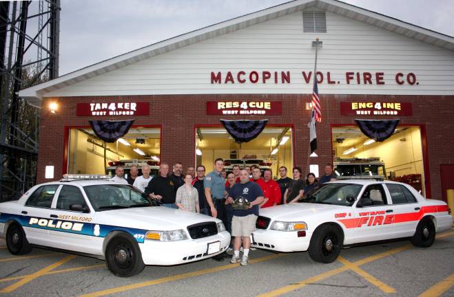 Members of the West Milford Police Department and West Milford Volunteer Fire Co. #4 are gearing up for another Saint Baldrick's Foundation Event on June 10. They are currently seeking contributors and volunteers to have their heads shaved in solidarity with children who have lost their hair in their battle with cancer. Last year the event netted $18,000. which was donated to chidlren's cancer research. Pictured here, at last year's planning session, are Co.#4 members and in center are the two event chairmen, Police Officer Robert Kulawiak on left, and volunteer fire fighter Dave LeMay, center right. Photo by Ginny Raue