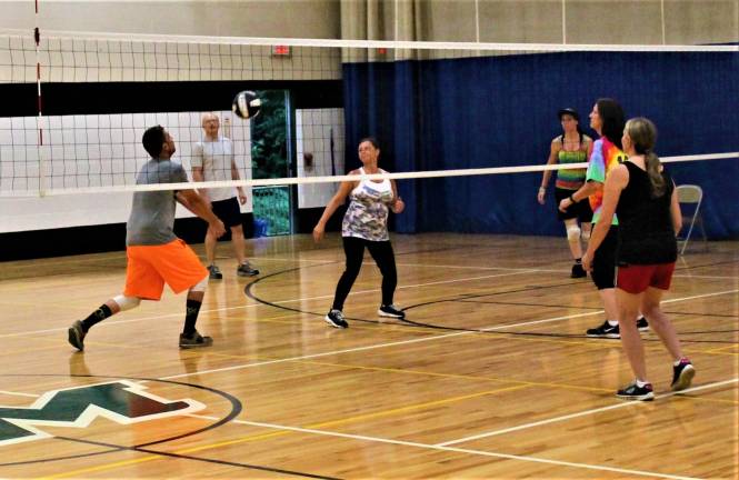 Teams compete during Wednesday night's volleyball program at the Rec Center.