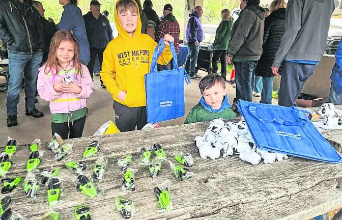 Youngsters, from left, Freya, Gavin and Asher show off Beautification Day gifts.