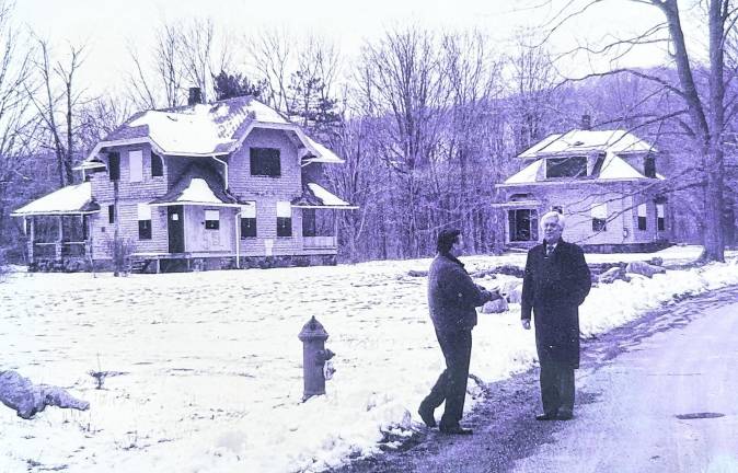 Richard DuHaime, Passaic County Freeholder (1985-1996) right, and late AIM Community News Publisher Joe Deery, stand on New City Road in 1995, enthusiastically discussing revitalization plans for the deserted New City community.