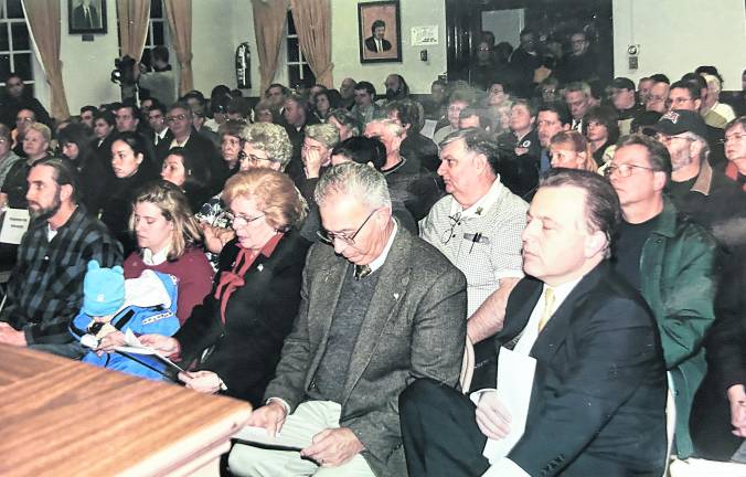 New Jersey State Assemblyman Alex DeCroce, State Sen. Joseph Pennacchio and Lyzbeth Glick, holding baby daughter Emerson, are in the front row at a memorial gathering at the West Milford Municipal Building soon after the 9/11/2001 World Trade Center Terrorist attack.