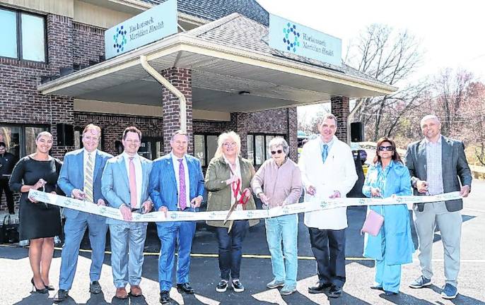 Officials on hand for the new Health and Wellness Center ribbon cutting at Highlander Family Medicine on Friday, April 10, 2026. (from left to right) Lucy Pereira-Argenziano, M.D., SVP, Ambulatory, Chief Medical Officer, Hackensack Meridian Health (HMH); Thomas Salazer, M.D., Chief Clinical Officer, Northern Region, Hackensack Meridian Medical Group; Michael Geiger, SVP, Ambulatory Care and Network Development, HMH; Mark Sparta, FACHE, President and Chief Operating Officer, HMH; West Milford Mayor Michele Dale; Councilwoman Marilyn Lichtenberg; George Guariglia, M.D., Family Medicine Physician; Lisa Tank, M.D., President, Hackensack University Medical Center; and Dr. Brian Kitchin, Superintendent of West Milford Schools.