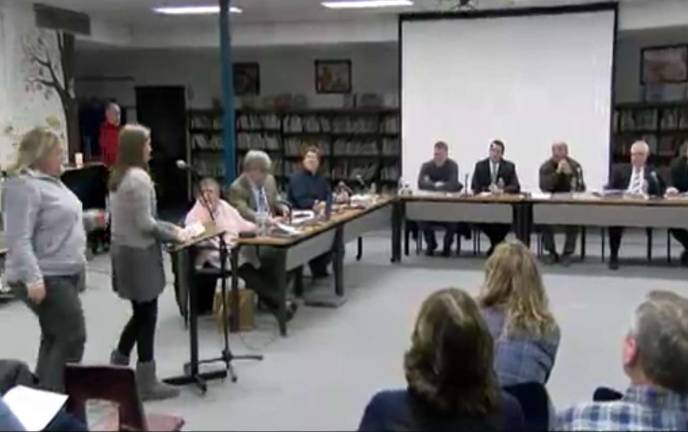Screen shot from West Milford TV Gioella Niosi, with her mom by her side, is seen here addressing the school board on March 1, telling them about her experience being bullied. She is currently being home schooled because of the bullying.