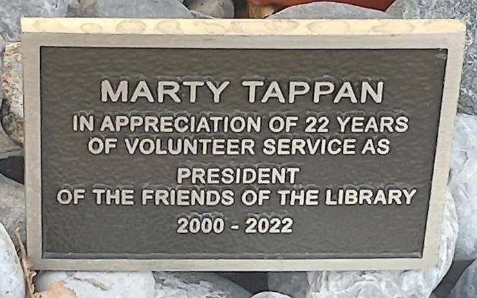 The Library Board honored Marty Tappan by presenting her with a special plaque.
