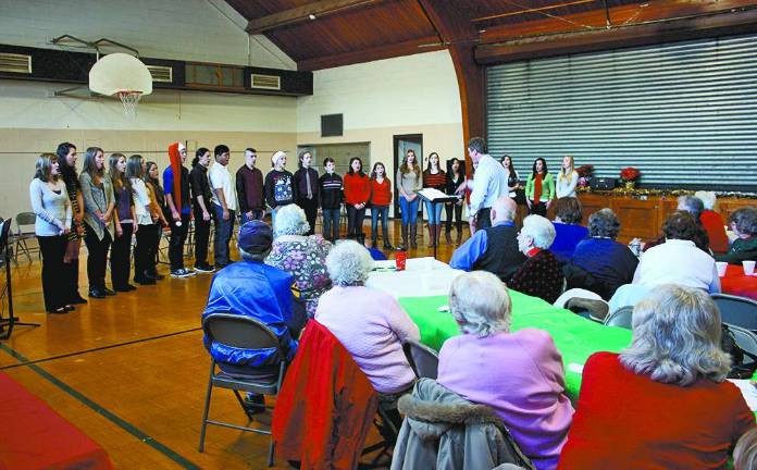 The West Milford High School Choir, under the direction of Doug Heyburn, performed for the seniors.