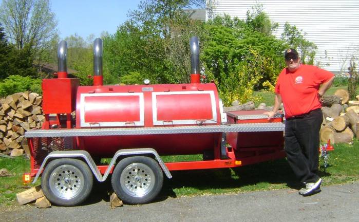 Dan "Chumley" Lemire, seen here with his smoker, is the BBQ man at Applewood. The owner of Chumley's restaurant in Florida will be providing the barbecue at the winery's BBQ and Blues Experience.