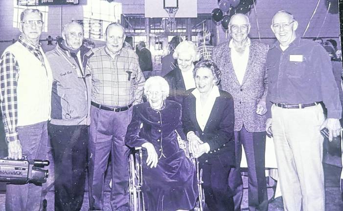 Mae Reilly and seven of her nine children are seen at her 100<sup>th</sup> birthday celebration in 1996.