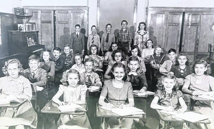 Students in the Newfoundland School upper grades are seen in 1947. The oldest were just six years old when World War II began. Students are: Row 1: Marge Sisco, Clarence Crane, Eugene Sisco. Row 2: Dawn Jennings, Wayne Post, Billy McCAnn, Sally Hewitt, Doris Post, Lawrence Davenport, Linda Chardavoyne. Row 5: LeRoy Tice, Jane Myers, Carl Stickles, Shirley Jennings, Bobby VanLuvender, Walter Crane. Row 4: Jean Richards, Carl Cahill, Jean Cahill, Ada VanderStad, George Crane, Eddie Paulison. Standing left to right: Eileen Cole, Doris Boulden, Luella Crowley Kemble teacher, Eddie VanderStad, Jerry Crane.