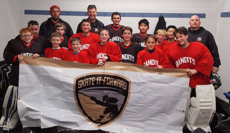 photos provided Coaches Joe Chromcik and Allen Magie, together with their young ice hockey players, gathered several truckloads of supplies for the troops overseas. They are shown with the New Jersey Bandits Pee Wee 12UB team.