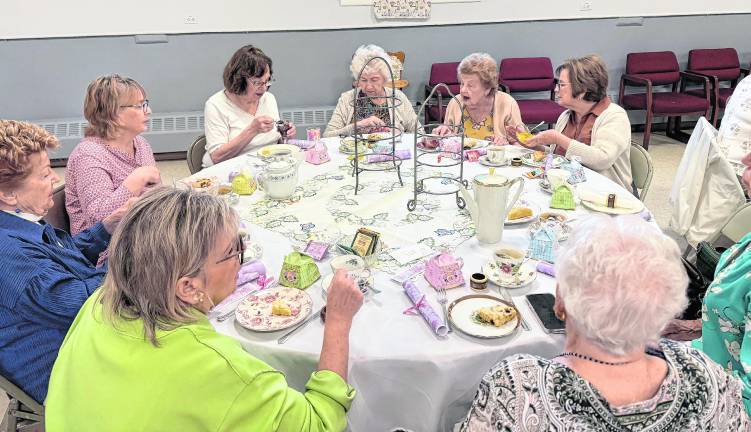 Women in elaborate hats and spring garb gathered at the West Milford Presbyterian Church’s annual Tea on April 18 for a traditional British tea and tricky tray. The tea is a fund raiser for the church’s various local service initiatives.