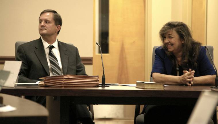 Photos by CHris Wyman Susan Kehoe smiles as she acknowledges about 10 of her supporters. Sitting with her is her attorney Daniel Perez.