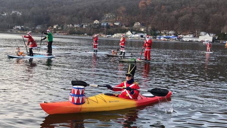 Paddle boarders and kayakers dress for the holiday.