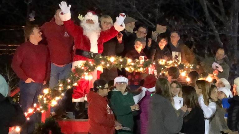 Santa waves to the crowd as he stands next to Mayor Michele Dale at the Christmas tree lighting ceremony Monday, Dec. 4 in West Milford. (Photo by Kathy Shwiff)