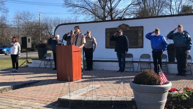 Lucien Barca, 16, senior patrol leader of Boy Scouts Troop 114, leads the Pledge of Allegiance. At left is Cindy LeMay, who organized the Wreaths Across America ceremony Saturday, Dec. 16.