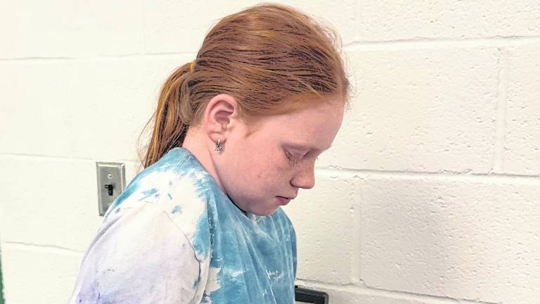 Brooke Prosper, 9, of West Milford mixes prior to baking.