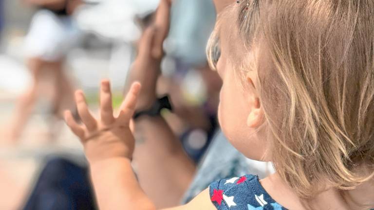 Brayleigh Conklin and her mother, Chelsea, of Greenwood Lake wave at her father, a firefighter in the Celebrate America Parade on Saturday, July 5. (Photos by Denise von Wilke)