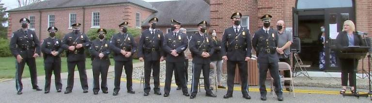 Members of the West Milford Police Department being promoted and appointed on Wednesday await their turn to individually take their oaths of office by Mayor Michele Dale.