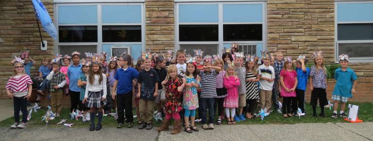 Students make pinwheels for whirled peace
