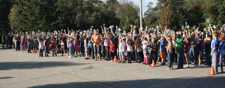 Students make pinwheels for whirled peace