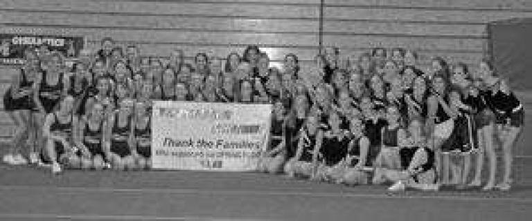 Gymnasts and cheerleaders combine efforts to buy spring board