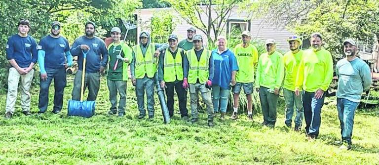 Landscaping professionals join forces to restore grounds at domestic violence shelter