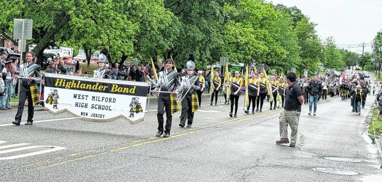 The West Milford High School Marching band performs during the parade.