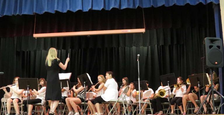 The sixth grade elementary advance band performs for parents and friends.