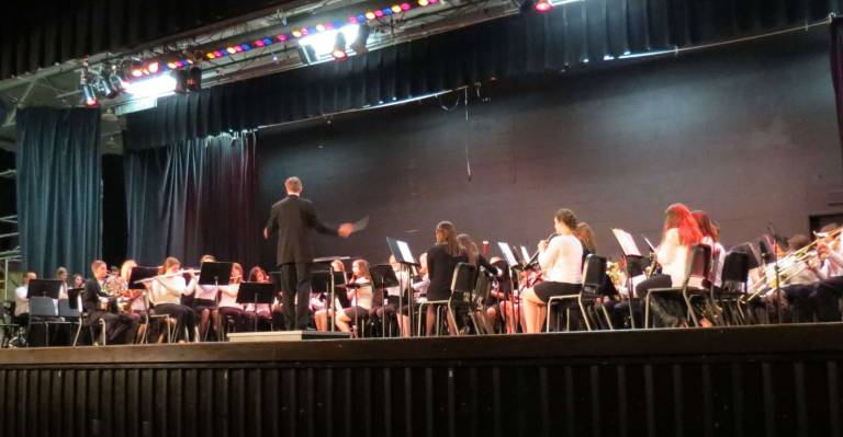 Seventh and eighth grade band members join together.