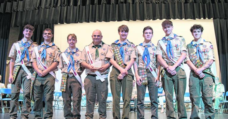 Scoutmaster Jimmy DaSilva, center is shown with Troop 151’s seven near Eagle Scouts.