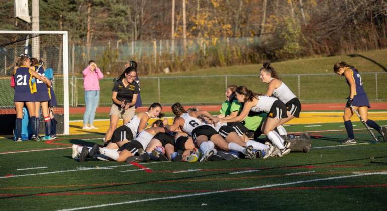The West Milford field hockey team celebrates a win over Vernon.