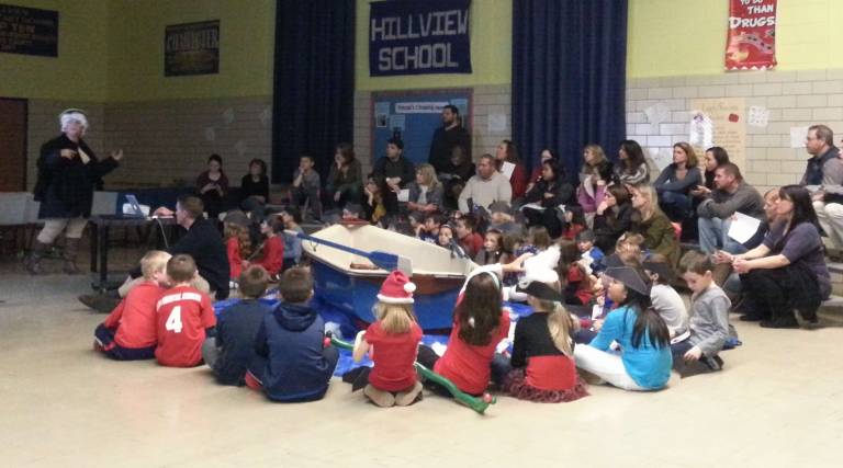 Media Specialist Valerie Munro presents "George Washington Crossing" in her trusty boat!