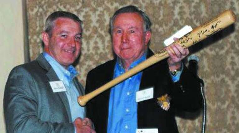 Col (Ret.) Barret Haight, right, (USMA 59þÄô grad and former Army baseball shortstop) accepts gift from Peter McCall, member of the Army Baseball Room Committee, at a ceremony at the Historic Thayer Hotel at West Point, March 30. The new Army Baseball Room is filled with Army baseball memorabilia and is one of many dedication rooms in the hotelþÄôs inventory which recognizes distinguished West Point graduates.