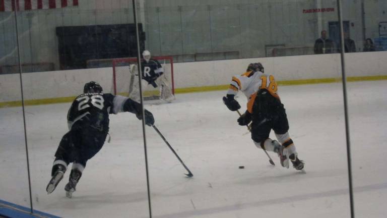 Photos by Alison Cosgrove West Milford's Fenui goes for the goal against Ramapo.