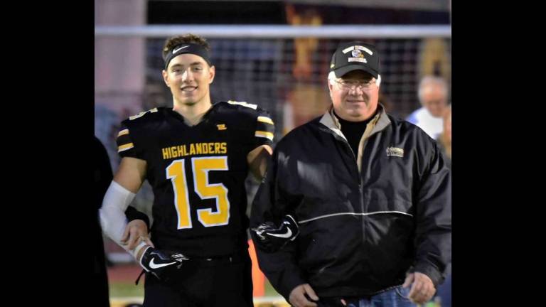 PHOTO provided Dean Montesano and his dad, James, take a break at the West Milford HIgh School Football Senior Night.